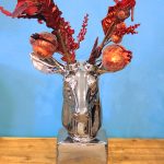 Silver ceramic tabletop reindeer. 