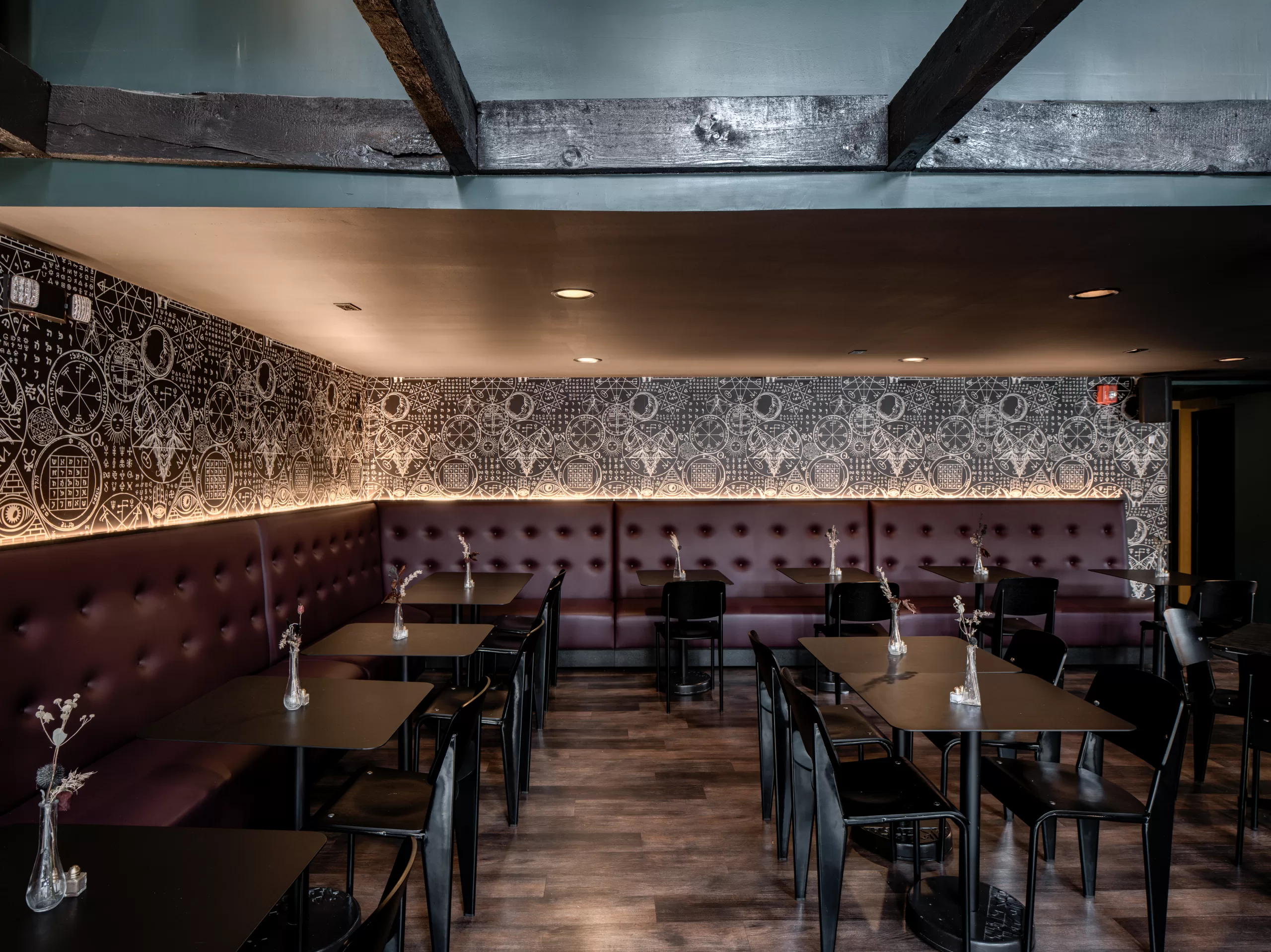 Interior of coffin bar, banquette seating 