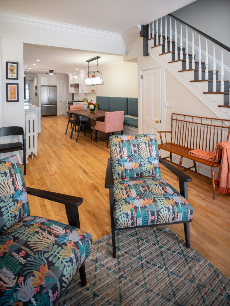 Living space leading into a dining area in an open floor plan row home.