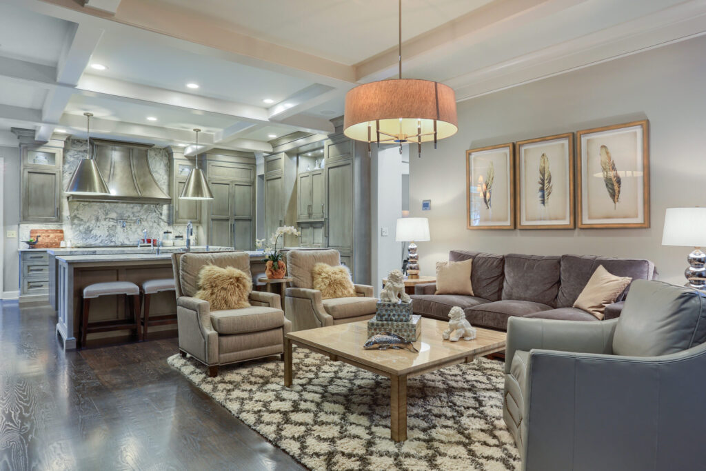 Living room with gray colors, beautiful artwork and modern luxurious feel.