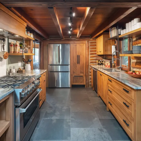 Kitchen that enhances the natural beauty of the log cabin.