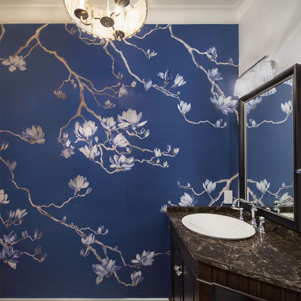 small powder room with elegant design, blue and white floral wallpaper, faux painted ceiling, chandelier, custom vanity