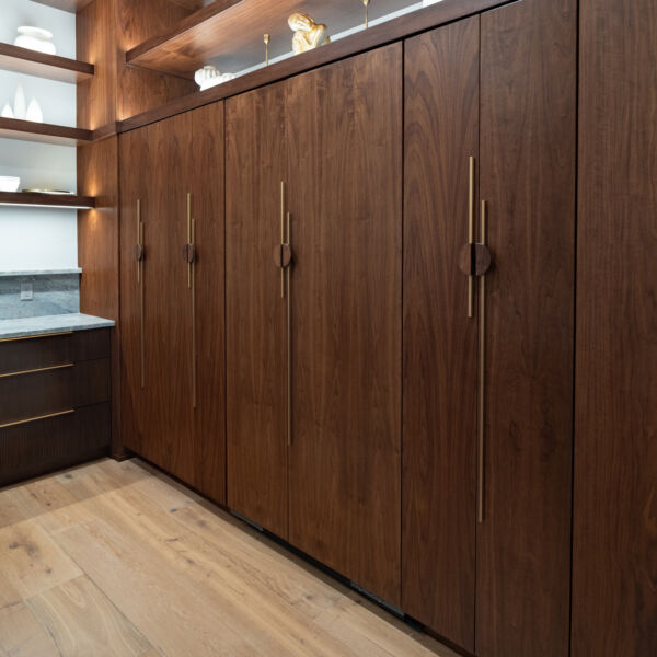Built-in refrigerator with custom panels photo of fridge hidden by readed paneling.