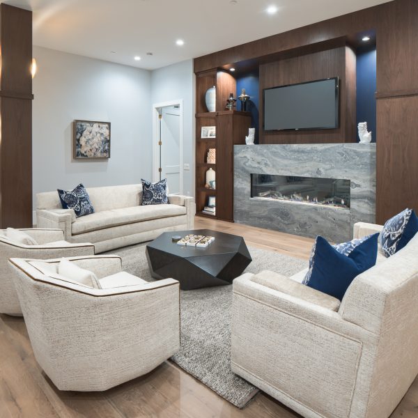 Great room with gas fireplace, open shelving, and conversation seating in Lancaster City, PA.